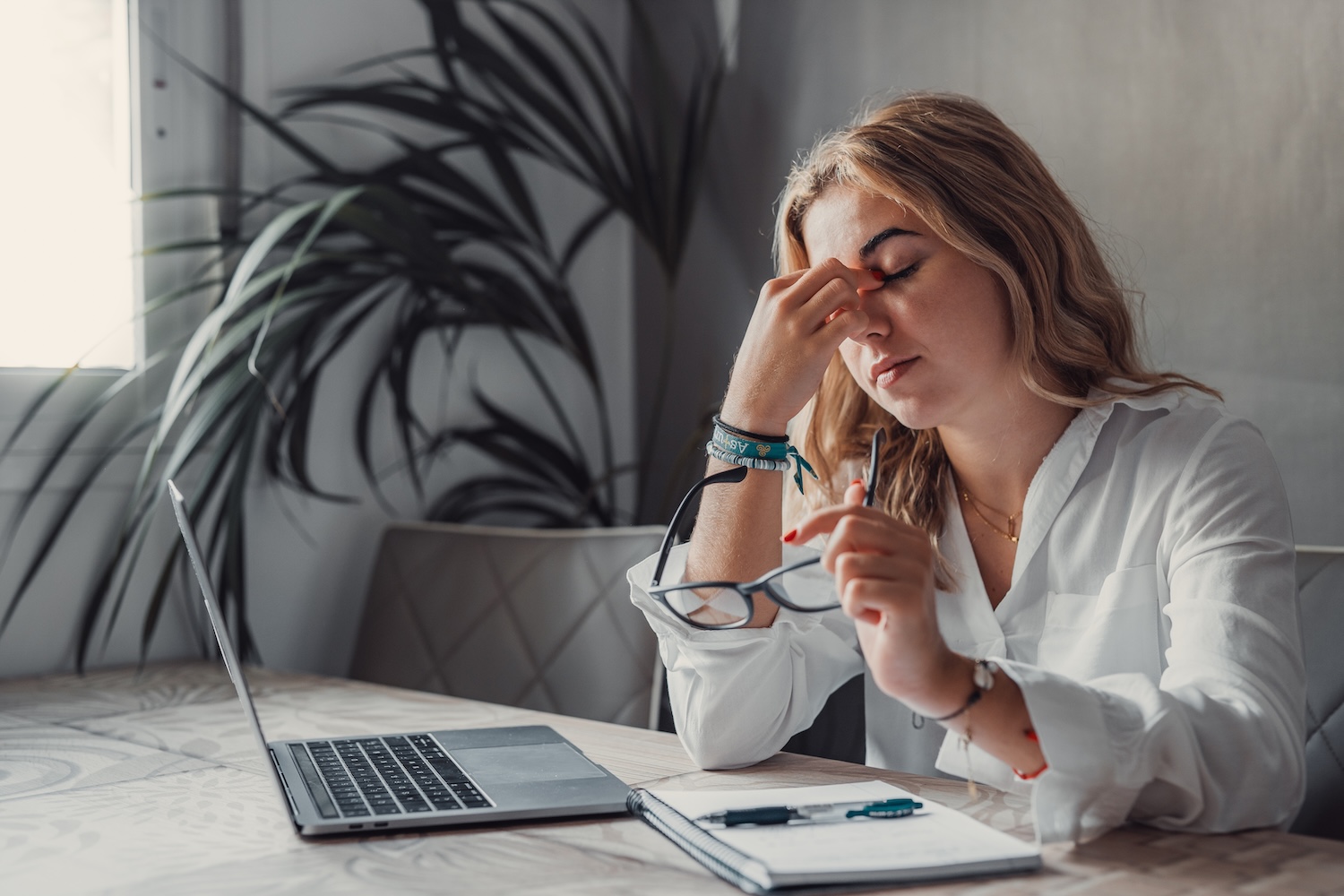 Stressed tired woman having strong headache
